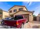 Two-story home with a front-facing two car garage and low maintenance desert landscaping at 2509 E Meadow Land Dr, San Tan Valley, AZ 85140