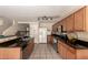 Well-equipped kitchen showcasing dark countertops, stainless appliances, and ample storage space at 2509 E Meadow Land Dr, San Tan Valley, AZ 85140