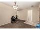 A room staged with minimal furniture and carpet flooring at 2509 E Meadow Land Dr, San Tan Valley, AZ 85140