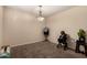 A room staged with minimal furniture and carpet flooring at 2509 E Meadow Land Dr, San Tan Valley, AZ 85140