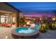 Outdoor living with a built-in spa, heated pool and spa. Outdoor lounge seating at 26285 N 89Th St, Scottsdale, AZ 85255