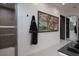 Elegant bathroom showcasing a modern shower with a luxurious robe and artwork at 26285 N 89Th St, Scottsdale, AZ 85255