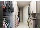 Well-organized walk-in closet with hanging rods, drawers, and shelves for optimal storage at 26285 N 89Th St, Scottsdale, AZ 85255