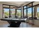 Beautifully staged game room featuring a modern pool table with exterior views and a nearby bar area at 26285 N 89Th St, Scottsdale, AZ 85255