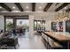 Kitchen open to adjacent dining and living space, with seamless access to the outdoor patio and pool at 26285 N 89Th St, Scottsdale, AZ 85255