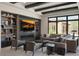 Comfortable living room with built-in bookshelves and media, with views of a well maintained front yard at 26285 N 89Th St, Scottsdale, AZ 85255