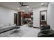 Open-concept living room with modern furnishings, a ceiling fan, and access to the kitchen at 26285 N 89Th St, Scottsdale, AZ 85255