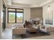 Bright living room with neutral palette, multiple seating areas, fireplace, and large window for natural light at 26285 N 89Th St, Scottsdale, AZ 85255