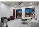 Inviting living room with neutral decor, a view of the outdoor patio, and a ceiling fan at 26285 N 89Th St, Scottsdale, AZ 85255