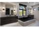 Serene main bathroom featuring dual vanities, a soaking tub, and plenty of natural light for a spa-like experience at 26285 N 89Th St, Scottsdale, AZ 85255