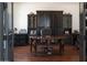 Elegant office space featuring a beautiful desk, ample storage, and rich hardwood floors at 26285 N 89Th St, Scottsdale, AZ 85255