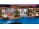 Amazing backyard featuring a pool, lounge seating, outdoor living space, fire features, and mature landscaping at 26285 N 89Th St, Scottsdale, AZ 85255