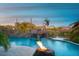Inviting pool with rock waterfall, fire features, and desert views creating a luxurious outdoor oasis at 26285 N 89Th St, Scottsdale, AZ 85255