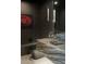 Contemporary powder room showcasing a unique vessel sink, stylish fixture, and dark wallpaper for a modern look at 26285 N 89Th St, Scottsdale, AZ 85255