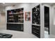 Elegant wet bar featuring custom cabinets, marble countertops, ample storage, and a convenient wine rack at 26285 N 89Th St, Scottsdale, AZ 85255