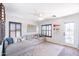 Bedroom featuring a comfortable seating area with a tan sectional sofa at 2990 E Franklin Ave, Gilbert, AZ 85295