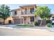 Inviting two-story home with a covered balcony, a two car garage, and desert landscaping at 2990 E Franklin Ave, Gilbert, AZ 85295