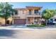 Charming two-story home with a balcony, desert landscaping, and a two-car garage at 2990 E Franklin Ave, Gilbert, AZ 85295