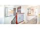 Upstairs hallway with wooden and metal railings, and an open view to a bedroom at 2990 E Franklin Ave, Gilbert, AZ 85295