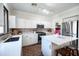 Modern kitchen with an island, stainless appliances, and white cabinets at 2990 E Franklin Ave, Gilbert, AZ 85295