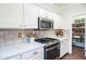 Modern kitchen with stainless steel appliances, quartz countertops, and walk-in pantry at 2990 E Franklin Ave, Gilbert, AZ 85295