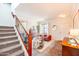 Bright living room featuring a cozy seating area and a staircase leading to the upper level at 2990 E Franklin Ave, Gilbert, AZ 85295