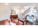 Open-concept living room featuring a staircase, sofa, and artistic accents at 2990 E Franklin Ave, Gilbert, AZ 85295