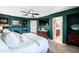 This spacious main bedroom features an ensuite bath, built-in bookshelves, and a ceiling fan at 2990 E Franklin Ave, Gilbert, AZ 85295