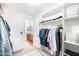 Walk-in closet with carpeted floors, wire shelving, and hanging rods at 2990 E Franklin Ave, Gilbert, AZ 85295