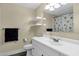 This bathroom features a modern vanity and a shower with a sunflower-themed curtain at 3116 W Calavar Rd, Phoenix, AZ 85053