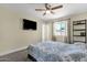 Bedroom with carpet, ceiling fan, and a window providing ample natural light at 3116 W Calavar Rd, Phoenix, AZ 85053