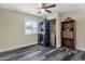 A secondary bedroom offering ample space, natural lighting, and neutral tones at 3116 W Calavar Rd, Phoenix, AZ 85053