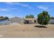 Charming single-story home featuring a two-car garage, manicured lawn, and attractive desert landscaping at 3116 W Calavar Rd, Phoenix, AZ 85053
