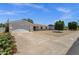Charming single-story home featuring a two-car garage, manicured lawn, and attractive desert landscaping at 3116 W Calavar Rd, Phoenix, AZ 85053