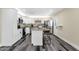 Bright modern kitchen with white cabinets, granite countertops, and stainless steel appliances at 3116 W Calavar Rd, Phoenix, AZ 85053