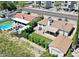 Aerial view of a home with a swimming pool, covered patio, detached garage, and astroturf yard at 3505 N Miller Rd, Scottsdale, AZ 85251
