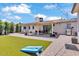 Expansive backyard with manicured turf, brick patio, and comfortable outdoor furniture at 3505 N Miller Rd, Scottsdale, AZ 85251