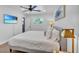 Bright bedroom with large windows, ceiling fan, and a queen bed, creating a serene atmosphere at 3505 N Miller Rd, Scottsdale, AZ 85251