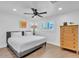 Bright and airy bedroom with hardwood floors, a large bed, and ample natural light at 3505 N Miller Rd, Scottsdale, AZ 85251