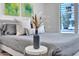 Serene bedroom with neutral tones, soft lighting, and tasteful decorations enhancing the relaxing atmosphere at 3505 N Miller Rd, Scottsdale, AZ 85251
