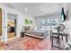 Bright bedroom featuring a comfortable bed, large windows, and elegant decor with stylish rug at 3505 N Miller Rd, Scottsdale, AZ 85251