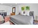 Comfortable bedroom with a plush bed, stylish artwork, and plenty of space for relaxation and rest at 3505 N Miller Rd, Scottsdale, AZ 85251