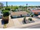 Charming home with well-maintained landscaping, a gravel driveway, and a welcoming entrance at 3505 N Miller Rd, Scottsdale, AZ 85251
