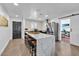 Updated kitchen showcasing a breakfast bar, stainless steel appliances and modern finishes at 3505 N Miller Rd, Scottsdale, AZ 85251