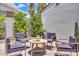 Cozy outdoor patio features brick pavers, a round table and 4 chairs, perfect for relaxing or entertaining at 3505 N Miller Rd, Scottsdale, AZ 85251