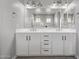 Bathroom with dual sinks, a large mirror, and stylish fixtures, offering a functional space at 3710 E Cheery Lynn Rd, Phoenix, AZ 85018