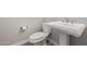 Bathroom with pedestal sink and toilet with grey walls and white trim at 3710 E Cheery Lynn Rd, Phoenix, AZ 85018