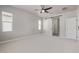 Bright bedroom featuring a modern ceiling fan, fresh paint, and a window for natural light at 3710 E Cheery Lynn Rd, Phoenix, AZ 85018