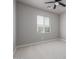Bedroom with a bright window, neutral walls, and cozy carpet, perfect for relaxation at 3710 E Cheery Lynn Rd, Phoenix, AZ 85018
