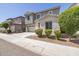 Charming two-story home with a two-car garage, gray stucco, and stone accents at 3710 E Cheery Lynn Rd, Phoenix, AZ 85018